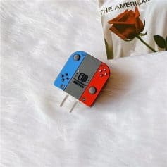 A Nintendo Switch LED dock featuring red and blue colors with detailed button and port design, perfect for gaming accessories or entertainment setup.