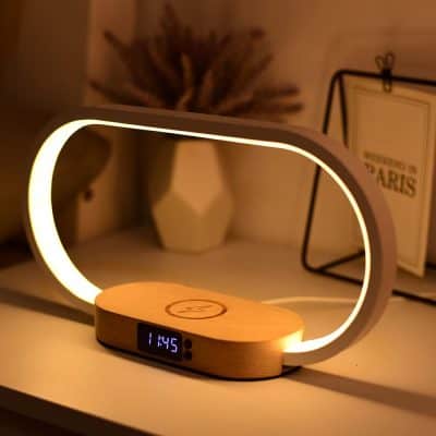 Stylish LED desk lamp featuring integrated wireless charging pad and digital clock, perfect for modern workspaces and bedside tables, enhancing productivity and ambiance.