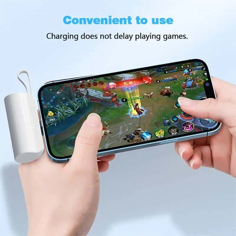 A portable gaming charging station attached to a smartphone, designed to keep your device charged while gaming. Ideal for gamers on the go, ensuring uninterrupted gameplay with easy-to-use design.