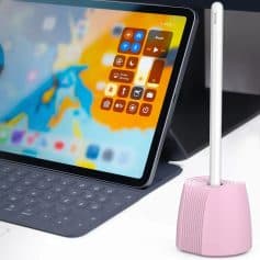 IPad with colorful screen displaying control icons, keyboard, and a pink dust blower for aesthetic skincare care.