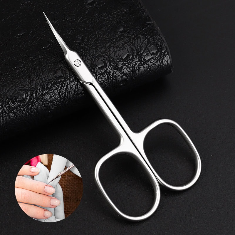 High-quality, stainless steel manicure scissors for precise cuticle and nail care, ideal for professional salons and home use. Ergonomic design ensures comfort and accuracy.