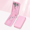 Portable manicure tools for healthy nails, includes scissors, tweezers, and cuticle pushers in a pink case. Perfect for at-home or on-the-go nail maintenance.