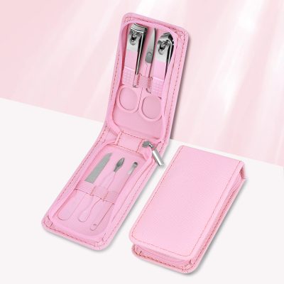 Portable manicure tools for healthy nails, includes scissors, tweezers, and cuticle pushers in a pink case. Perfect for at-home or on-the-go nail maintenance.