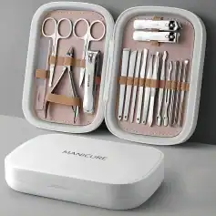 High-quality manicure toolset with scissors, nail clippers, nail file, cuticle pusher, and tweezers in a sleek portable case for professional and home use.