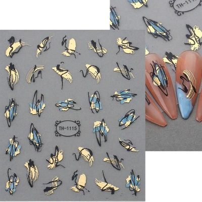 Nail art stickers featuring delicate blue, black, and cream designs perfect for stylish manicures. Ideal for professional salons or personal nail decorating projects.
