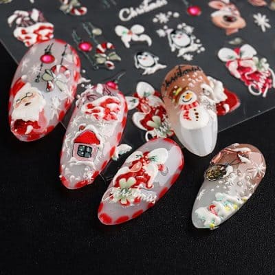 Detailed holiday-themed nail design with Santa, snowman, and Christmas motifs, perfect for seasonal beauty trends.