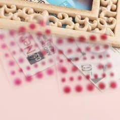 High-quality pink and red dot nail stickers from Monalisa Medical for flawless manicure and pedicure beauty enhancement.