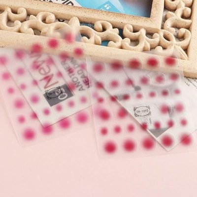 High-quality pink and red dot nail stickers from Monalisa Medical for flawless manicure and pedicure beauty enhancement.