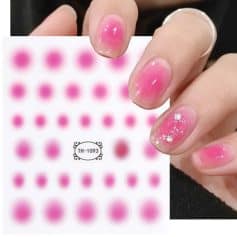 Detailed image of pink gel nail art stickers with rhinestone accents for nail enhancement and decoration. Perfect for stylish, eye-catching manicures.