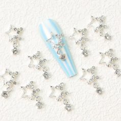 Beautiful silver star-shaped nail charms with embedded rhinestones, perfect for enhancing nail art designs. Ideal for manicure, pedicure, and nail art enthusiasts seeking a touch of sparkle.