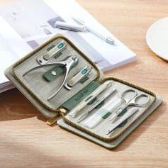 Portable optometry kit with scissors, forceps, and other eye examination tools.
