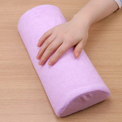 Soft pink foam exercise roller for physical therapy and yoga practice.
