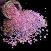 Vibrant pink rhinestones scattered from a jar, perfect for nail art, beauty decoration, and craft projects. Bright, eye-catching, and ideal for stylish accessories and beauty enhancements.