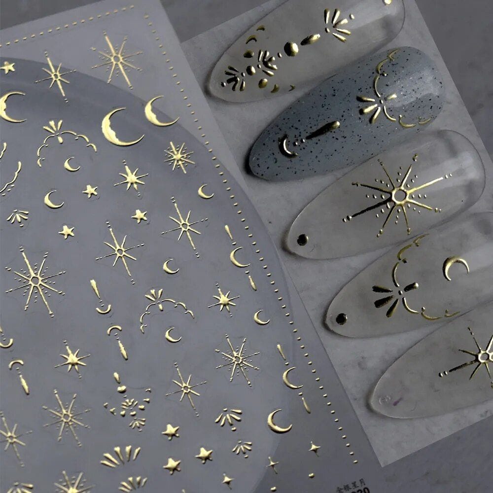 Decorative gold foil nail decals with celestial moon and star designs for elegant manicures and nail art. Perfect for creating cosmic-inspired looks at Monalisa Store.