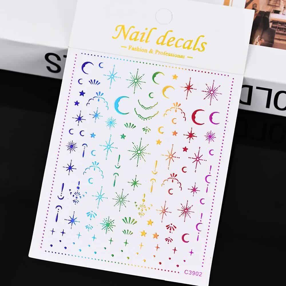 Colorful nail decals with moon, star, and celestial designs for professional and salon nail art inspiration. Perfect for creating trendy, eye-catching manicures.