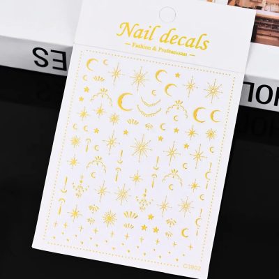Gold moon and star nail decals for professional nail art and decoration, temporary tattoos for DIY nail design, easy to apply for salon or home use.
