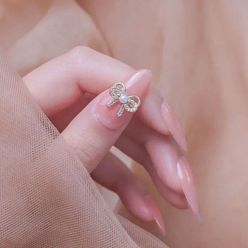 Pearl and crystal bow ring, delicate jewelry for women, adding charm to rings collection, perfect for gifting or personal style.