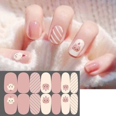 Delicate pastel pink and white animal-themed nail design with striped accents, perfect for a cute and fashionable manicure. Show off adorable animal nail art with detailed character illustrations.