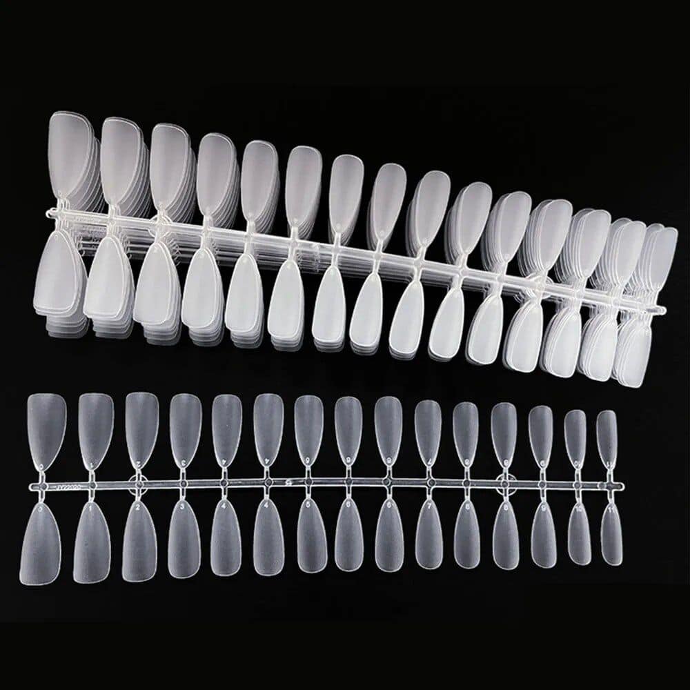 A professional nail tip display rack with clear plastic false nails for salon or clinic use, ideal for nail art, acrylic, gel, or natural nail enhancement. Perfect for showcasing nail designs.