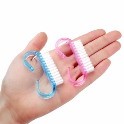 Miniature contact lens cleaning tools with blue and pink hooks for easy handling and cleaning of contact lenses, essential for eye health.
