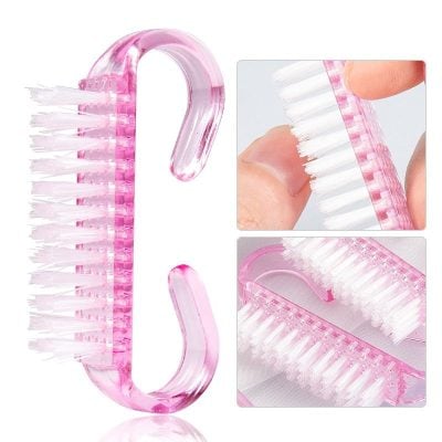 Portable pink glasses cleaning brush for opticians and eyewear maintenance.