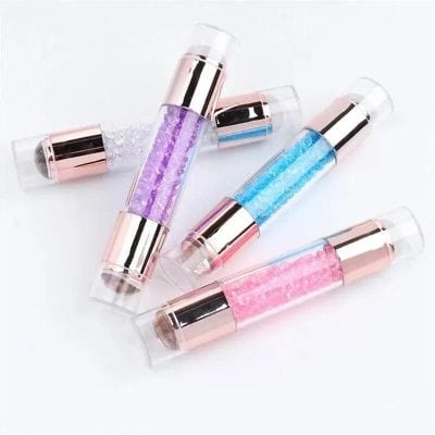 Beautiful collection of colorful lip gloss tubes with pearl and glitter accents, perfect for beauty and makeup lovers. Stunning, vibrant shades to enhance your look.