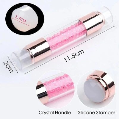 Gentle facial massage roller with pink crystals, 11.5cm long, perfect for skincare, under eye puffiness, and facial rejuvenation. Features smooth crystal handle and silicone stamper for enhanced skin care.