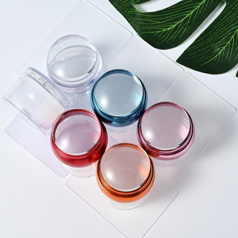 Brightly colored eye cream containers with transparent glass lids, perfect for skincare products. Ideal for cosmetic storage and beauty routines.