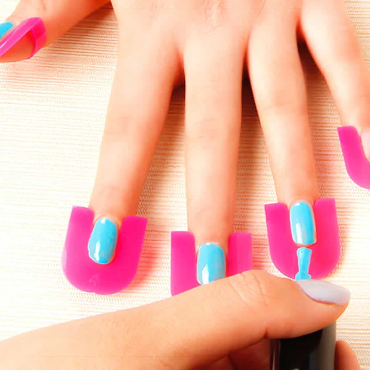 High-quality artificial nail extensions with vibrant pink tips and bright blue nails, perfect for stylish manicures and nail art enthusiasts.