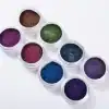 Multicolored cosmetic glitter powders for eye and face makeup.