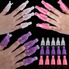 Colorful press-on nail polish bottles in pink, purple, white, and clear with reusable finger protectors.