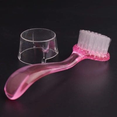 Eyecare mini brush and cupped applicator for contact lens cleaning and application.