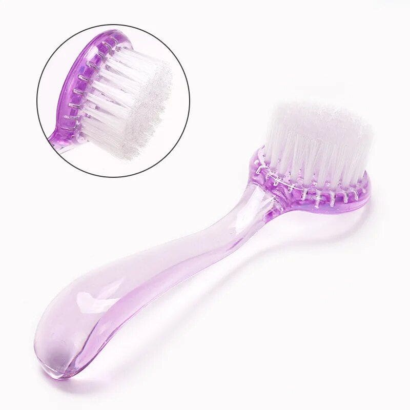 Pink nail cleaning brush for manicure and pedicure care. Perfect for removing dirt and residue from nails with soft bristles. Durable, portable, and ideal for professional salons or home use.