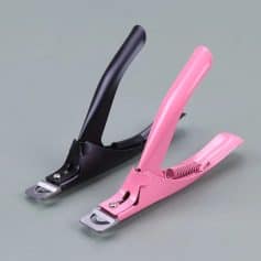 Modern black and pink stapler for efficient document binding at medical or office settings. Durable metal parts and ergonomic design for smooth stapling.