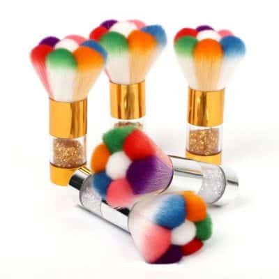 Colorful makeup brushes with fluffy, multicolored heads and sleek metallic handles for professional beauty application and skincare routines.