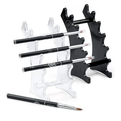 Elegant acrylic and black display stand for optical frames and lenses.