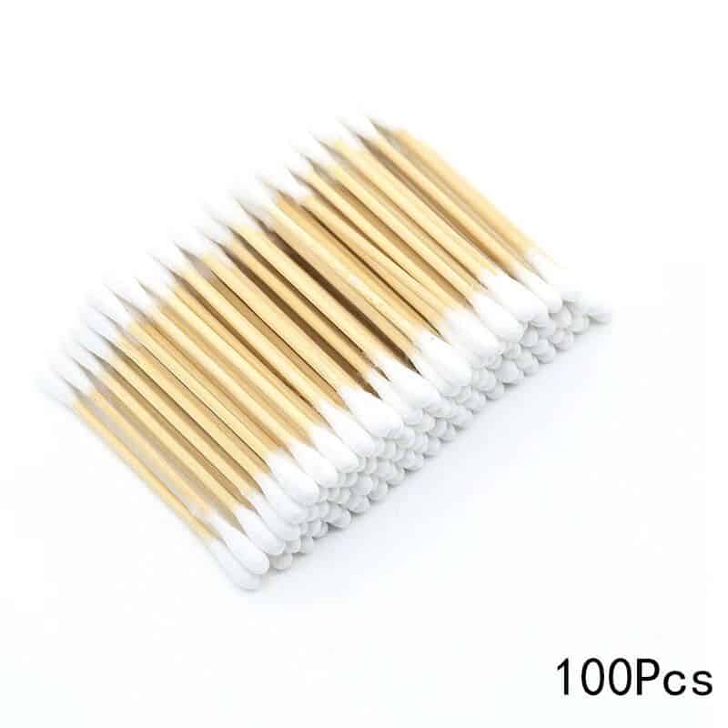 Sterile wooden cotton swabs for hygiene and medical use, 100-piece pack safe for skincare and cosmetic applications.