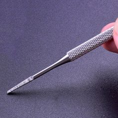 Close-up of a high-precision micro-dermal needle used for beauty treatments, dermal procedures, or skincare in a professional medical setting, highlighting its detailed craftsmanship.