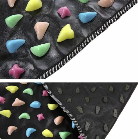 Bright, multicolored rock climbing holds on black padded flooring, designed for indoor climbing gyms, bouldering, and fitness training, offering secure grip and durability.