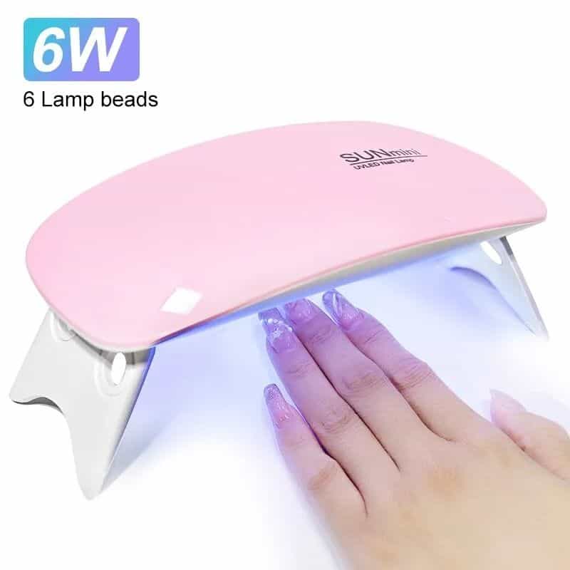 Professional UV/LED nail curing lamp for fast manicure drying, with 6 lamp beads and 36W power for efficient gel nail polish. Perfect for salons and home use.
