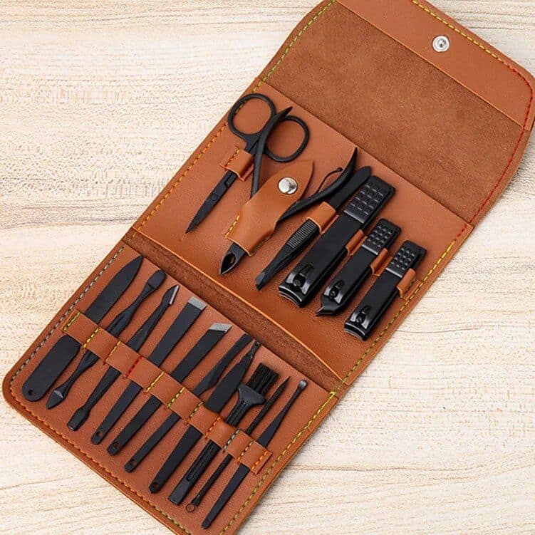 Premium manicure kit for nail grooming and beauty care. Includes scissors, nail clippers, tweezers, cuticle tools, and more in a portable leather case. Perfect for professional and home use.