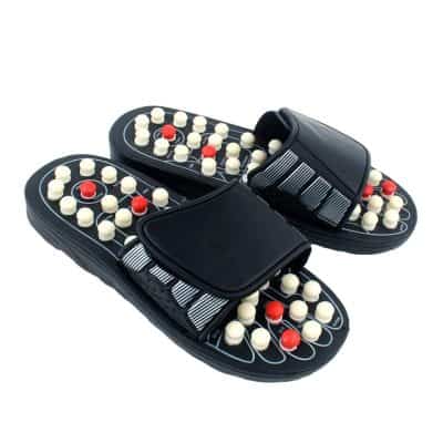 Comfortable reflexology slippers with massage rollers for foot therapy and relaxation.
