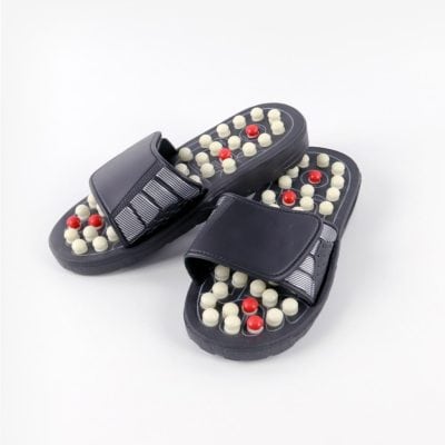 Comfortable black massage slippers with acupressure massage technology.
