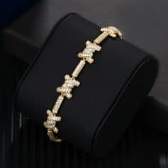 Luxurious gold bracelet adorned with sparkling butterfly motifs, perfect for upscale fashion and jewelry enthusiasts.