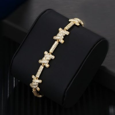 Luxurious gold bracelet adorned with sparkling butterfly motifs, perfect for upscale fashion and jewelry enthusiasts.