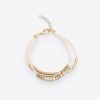 A chic gold and white layered necklace featuring modern geometric design, perfect for enhancing any outfit. Crafted with high-quality materials for a fashionable and versatile look.