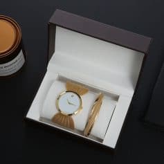 Stylish gold-tone wristwatch with butterfly accents and matching bangles, perfect for special occasions or daily wear.