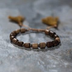 Natural wooden beaded bracelet with adjustable cord, perfect for stylish accessories and jewelry gift ideas, ideal for casual or bohemian fashion.