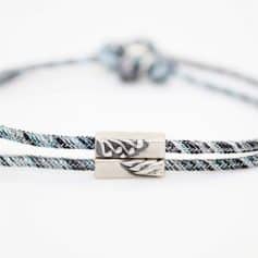 A stylish, high-quality braided eyeglass chain with silver accents, designed to keep your glasses secure and easily accessible. Perfect for eye care and eyewear fashion.