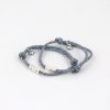 Men’s fashion bracelet made from durable stainless steel cord, featuring sleek charms and adjustable knots for a perfect fit. Stylish accessory for everyday or special occasions.